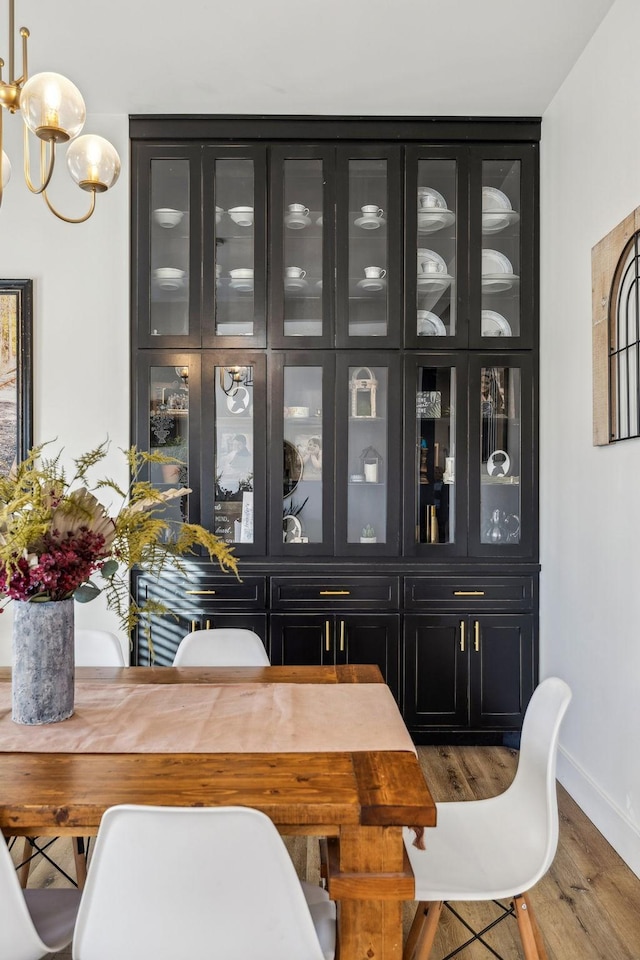 dining space featuring hardwood / wood-style flooring