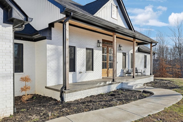 view of side of home with a porch