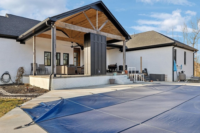 back of house featuring ceiling fan