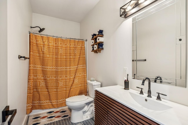 bathroom featuring vanity, curtained shower, and toilet