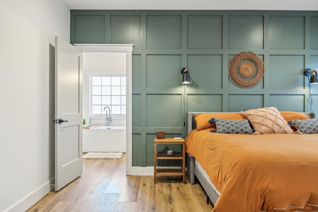 bedroom with light wood-type flooring