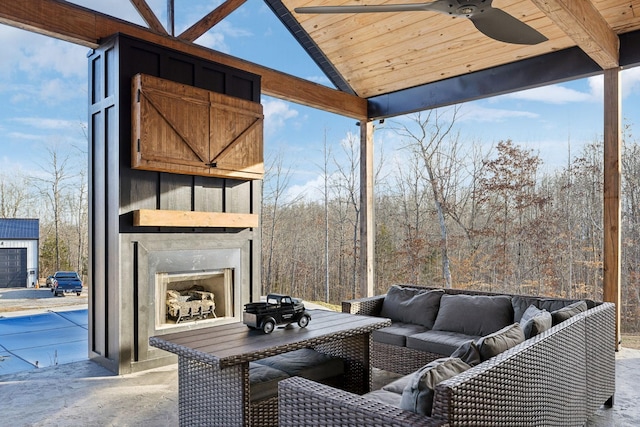 view of patio with exterior fireplace