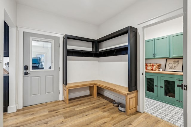 mudroom with light hardwood / wood-style flooring