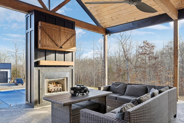 view of patio with an outdoor fireplace