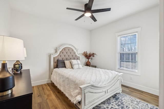 bedroom featuring hardwood / wood-style flooring and ceiling fan