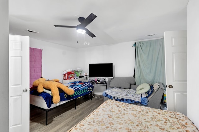 bedroom with hardwood / wood-style flooring and ceiling fan