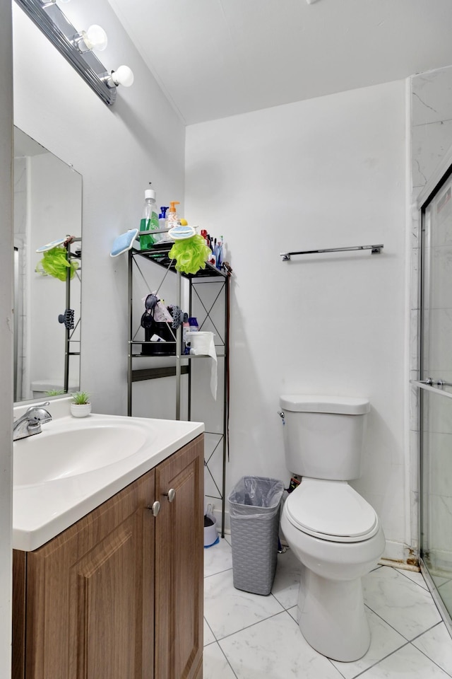 bathroom with walk in shower, vanity, and toilet