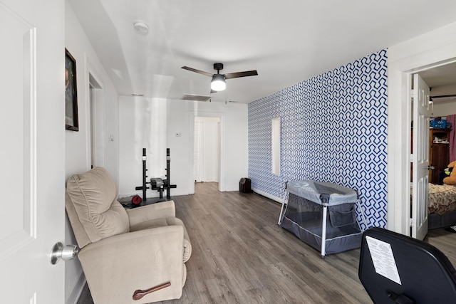 sitting room featuring hardwood / wood-style flooring and ceiling fan