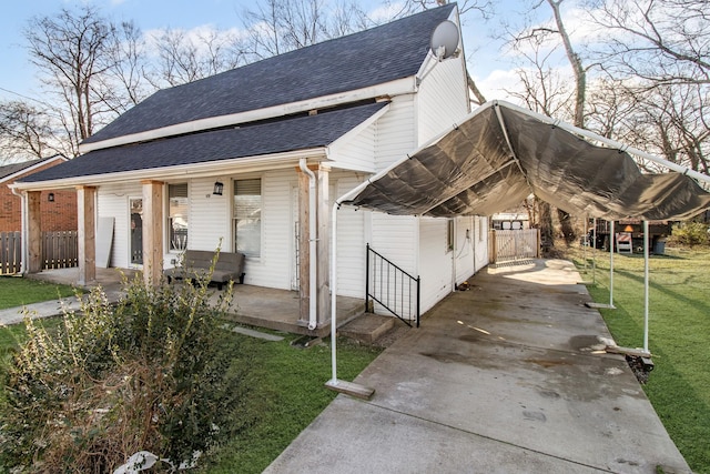 exterior space featuring a yard and covered porch