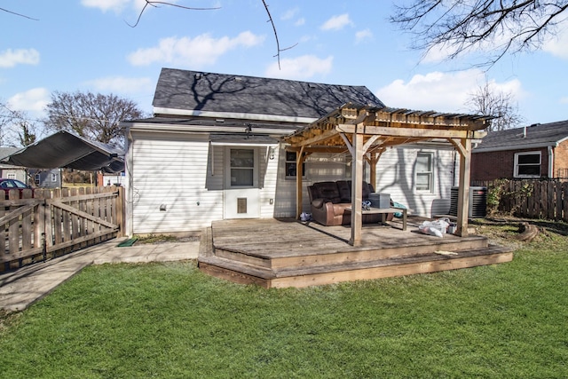 back of house with a wooden deck, a lawn, central AC unit, and a pergola