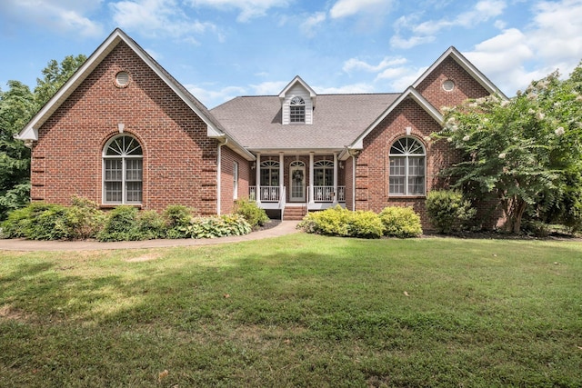 front of property featuring a porch and a front yard