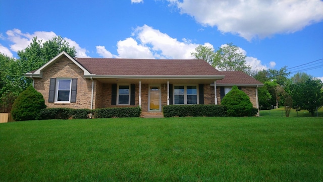 ranch-style house with a front lawn