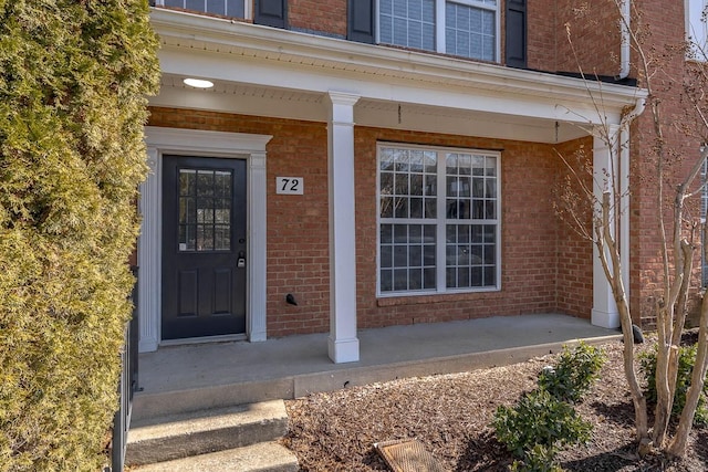 entrance to property featuring a porch