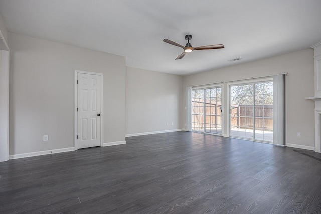 spare room featuring ceiling fan and dark hardwood / wood-style floors