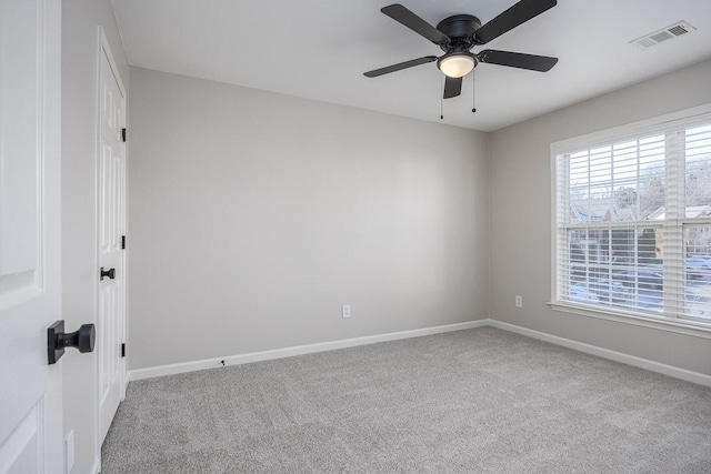 carpeted empty room with ceiling fan