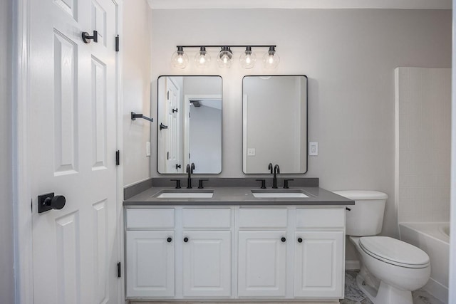 full bathroom with vanity, washtub / shower combination, and toilet