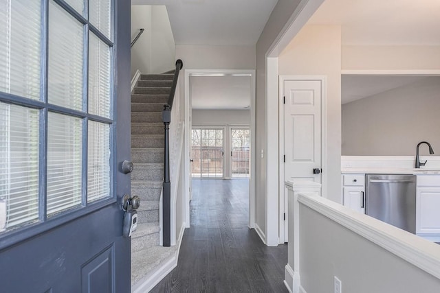 foyer featuring dark hardwood / wood-style flooring and sink