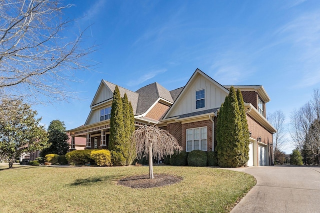 view of front of house with a garage and a front yard