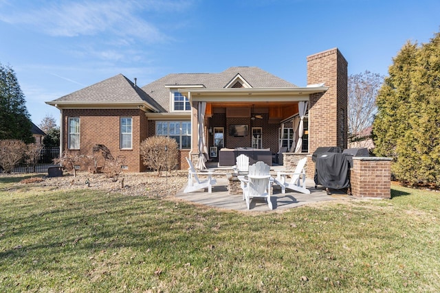 rear view of house with outdoor lounge area, a patio, and a lawn