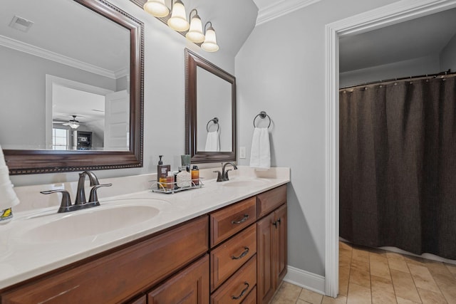 bathroom with tile patterned flooring, crown molding, and vanity