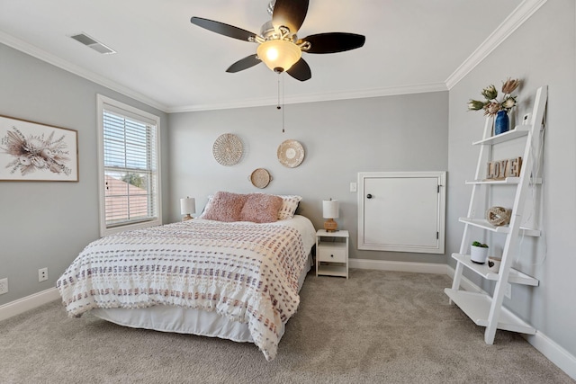 carpeted bedroom featuring ornamental molding and ceiling fan