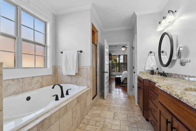 bathroom with ornamental molding, independent shower and bath, and vanity