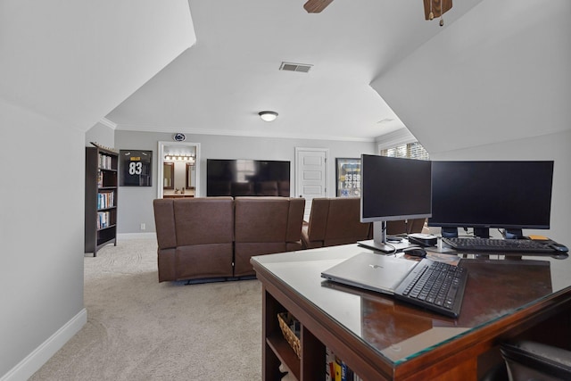 office space with crown molding, ceiling fan, and light carpet