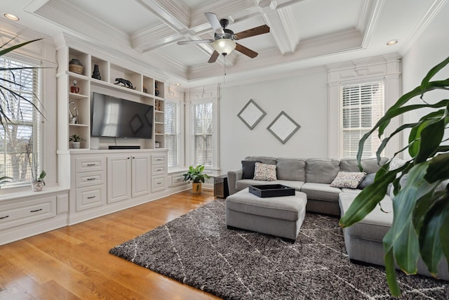 living room with coffered ceiling, hardwood / wood-style floors, ornamental molding, and beamed ceiling