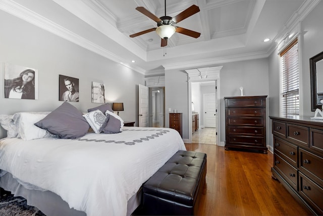 bedroom featuring dark hardwood / wood-style flooring, crown molding, coffered ceiling, and ceiling fan