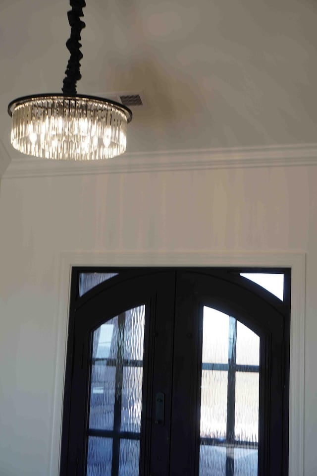 details with french doors and crown molding