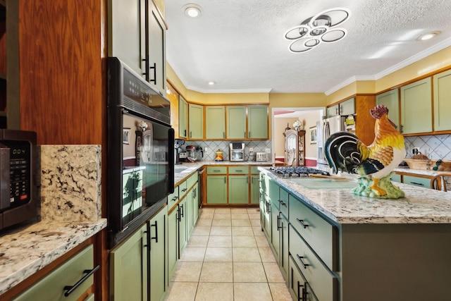 kitchen featuring crown molding, light tile patterned floors, decorative backsplash, and green cabinetry