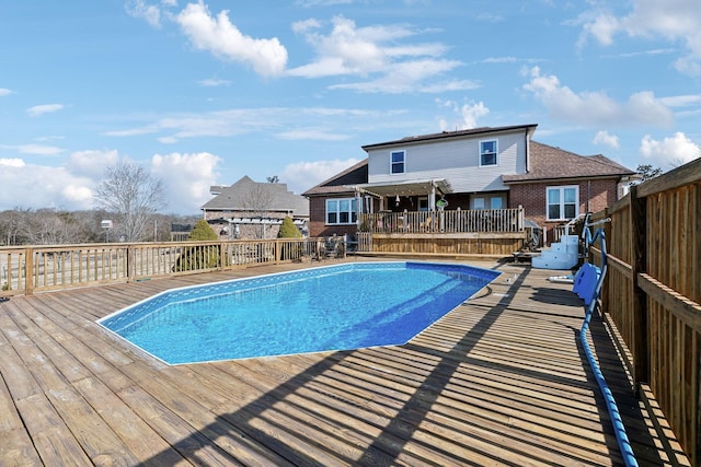 view of pool featuring a deck and a pergola