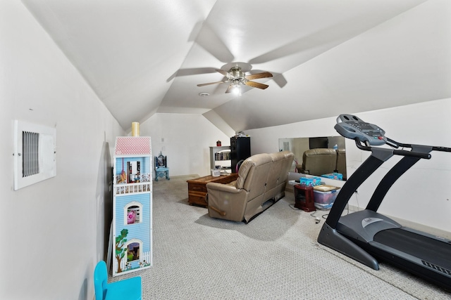 workout room with vaulted ceiling, light colored carpet, and ceiling fan