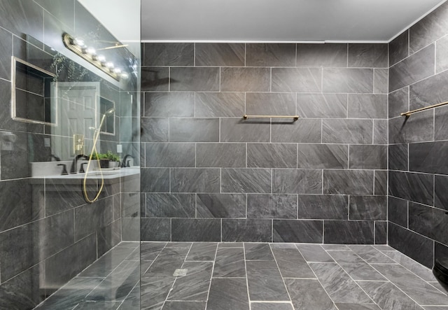 bathroom with a tile shower