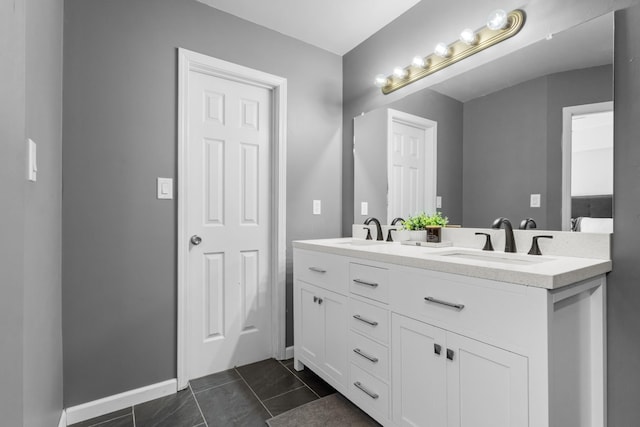 bathroom featuring tile patterned flooring and vanity