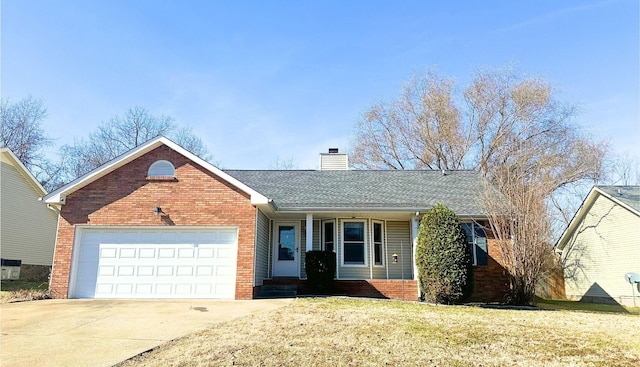 view of front of home featuring a garage and a front lawn