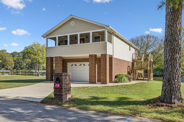 view of front of property with a garage and a front lawn