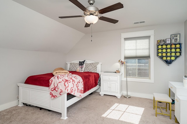 carpeted bedroom with vaulted ceiling and ceiling fan