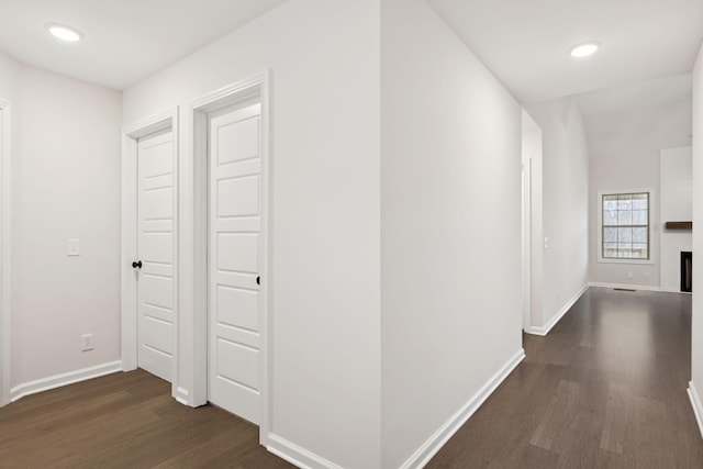 hall with dark hardwood / wood-style flooring