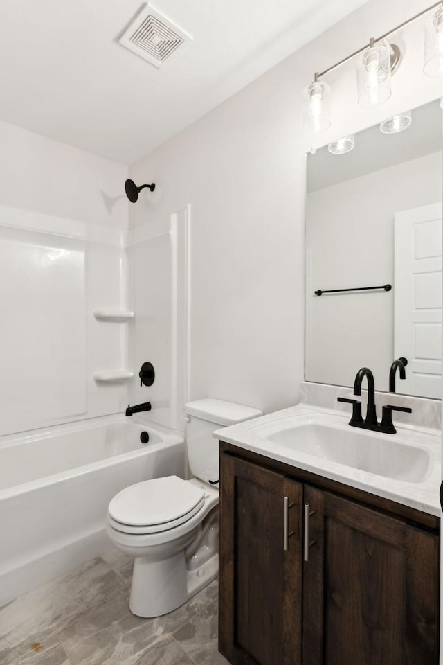 full bathroom featuring vanity, shower / tub combination, and toilet