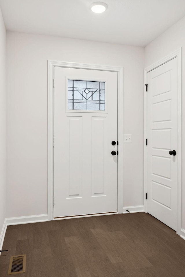 foyer entrance with dark hardwood / wood-style flooring