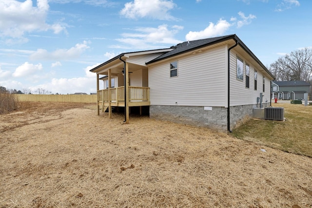 view of side of property with covered porch