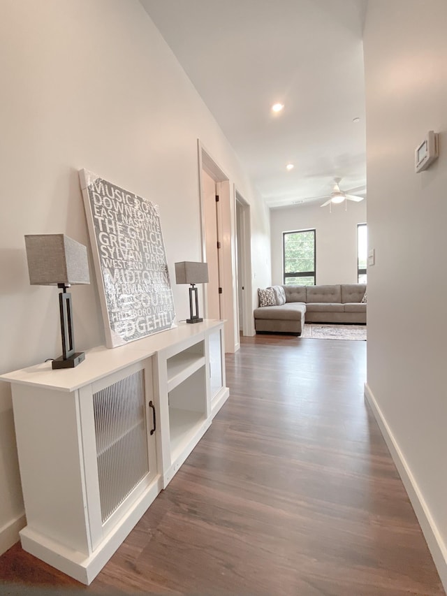 corridor featuring dark hardwood / wood-style floors