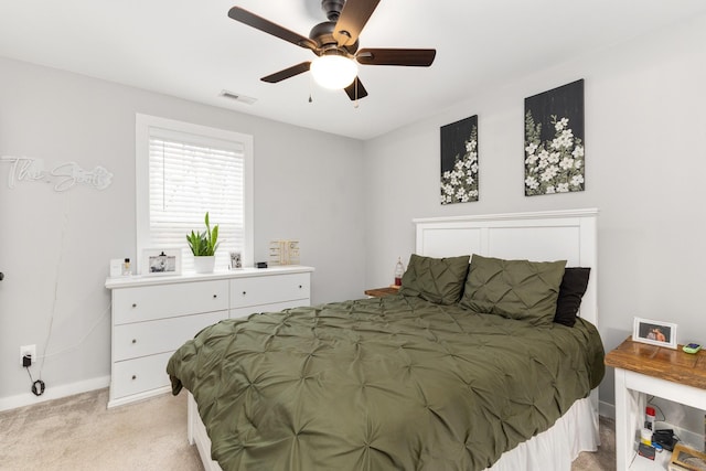 bedroom with light carpet and ceiling fan