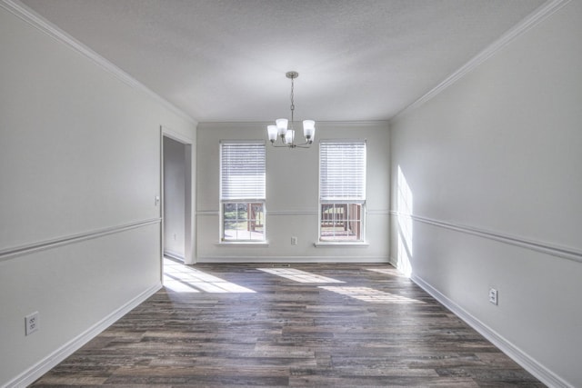 unfurnished dining area with a notable chandelier, dark wood-type flooring, and ornamental molding