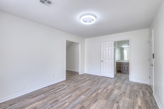 unfurnished room with hardwood / wood-style floors