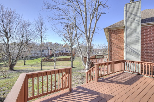 wooden terrace with a yard