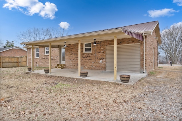 back of house with a patio and ceiling fan