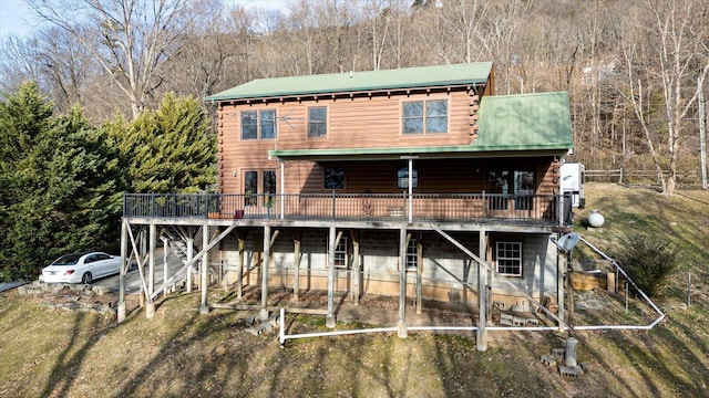 view of front of property with a wooden deck