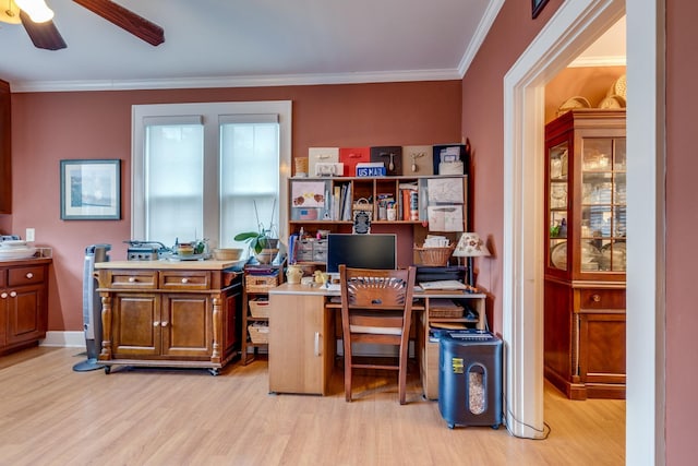 office space with ornamental molding, ceiling fan, and light wood-type flooring